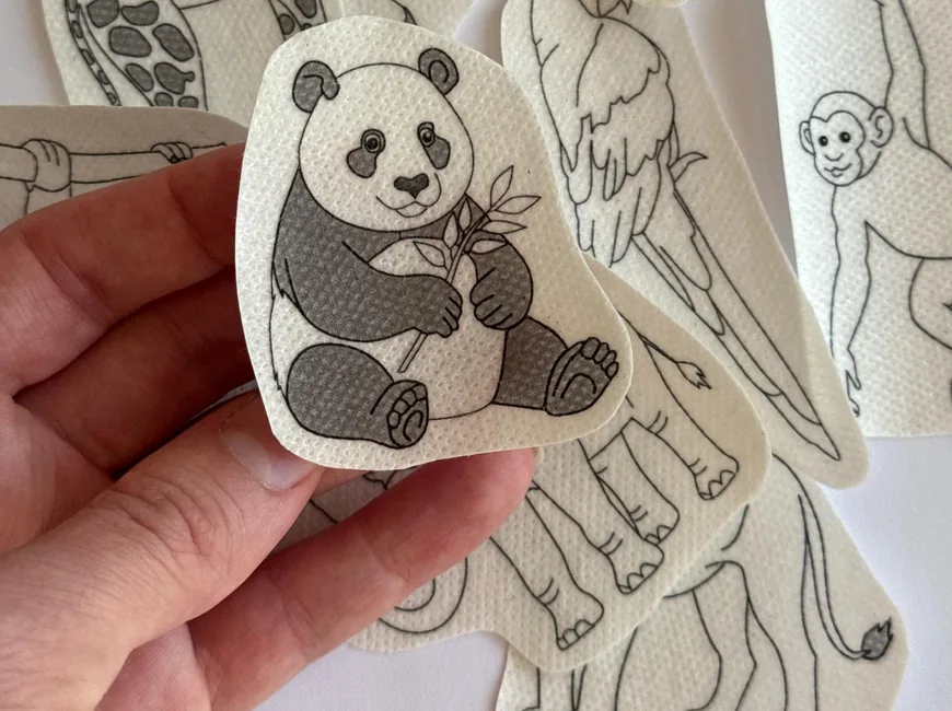 Stick-and-stitch embroidery designs of a panda, a giraffe, a tiger and other animals